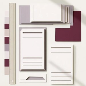 Layered unprinted menu-card mockups with curved paper edges in cream and muted burgundy tones. The arrangement shows contrasting paper shapes and soft shadows for a modern table-stationery design.