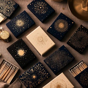 Dark matchbox mockups styled for an evening celebration, with plain and gold-toned decorative sleeve designs. The presentation shows compact rectangular boxes for personalised party favours.