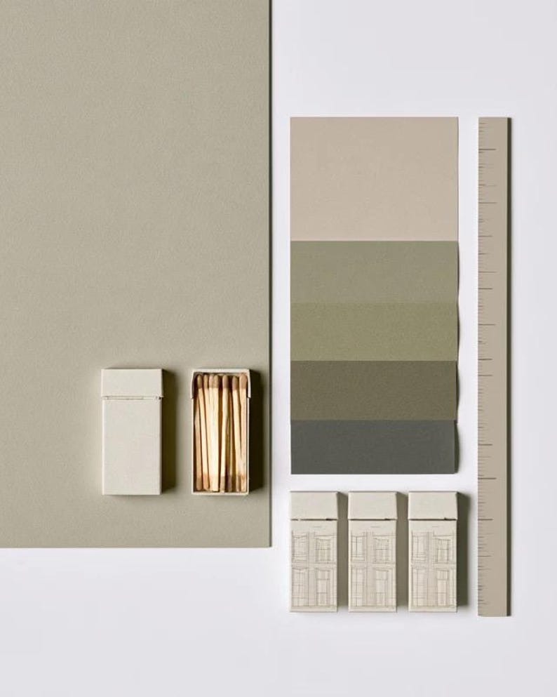 Cream rectangular drawer-style matchbox mockups arranged with coordinating neutral paper samples. The presentation shows sleeves, trays and the compact box proportions for bespoke event designs.