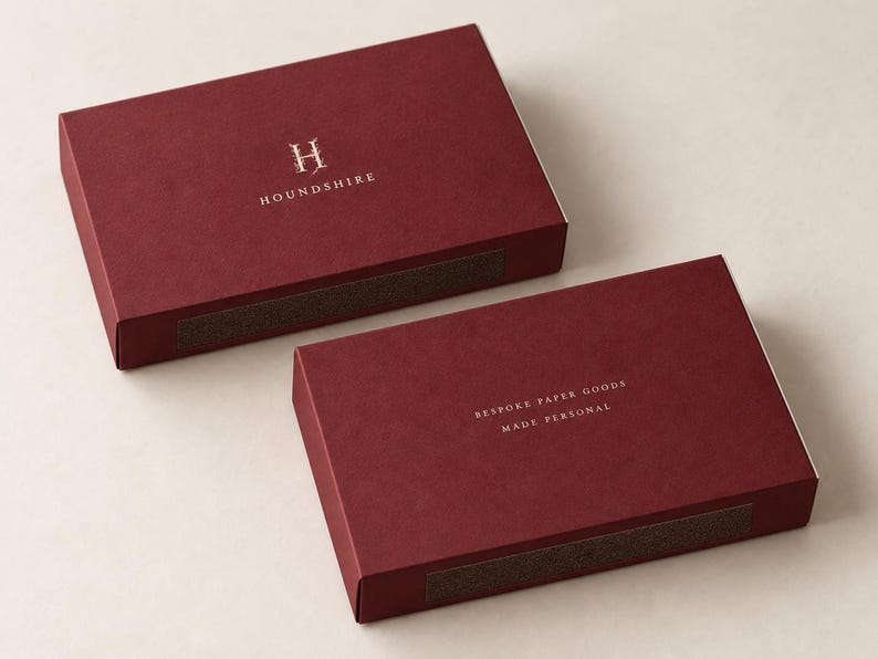 Burgundy oversized matchbox with a printed monogram