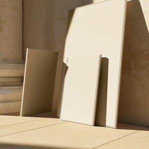 A tall cream wedding-sign mockup displayed upright with coordinated cream and olive paper stationery on a neutral surface. Soft daylight highlights the simple rectangular layout and paper textures.