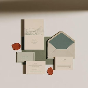 Contemporary matchbox mockup with a coloured paper sleeve and a clean graphic layout. The rectangular box is presented in soft directional light as a personalised wedding or event favour concept.