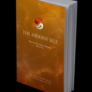 May include: A softcover book titled The Hidden Self: What Your Twin Flame Is Mirroring Back to You by Kristen Mae Devoue. The cover features a deep orange, smoky background with a red and white circular logo at the top and white text.