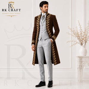 May include: A brown velvet long coat featuring gold floral embroidery along the lapels and cuffs, paired with a light gray vest, matching trousers, and a cravat. The RK CRAFT logo and text are visible in the upper left corner of the image.