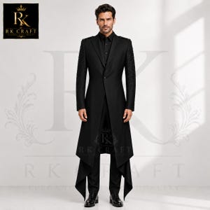 May include: A black long-line blazer featuring a single-button closure, structured shoulders, and intricate tonal embroidery on the sleeves. The garment is paired with matching black trousers and a black button-down shirt, with RK CRAFT branding.