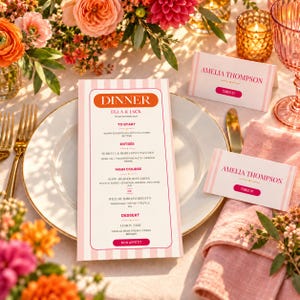 May include: A dinner menu card with pink stripes and orange text, placed on a white plate. Two matching place cards read AMELIA THOMPSON TABLE 01. The menu lists courses including sourdough, burrata, beef cheek, risotto, and lemon tart, with gold cutlery.