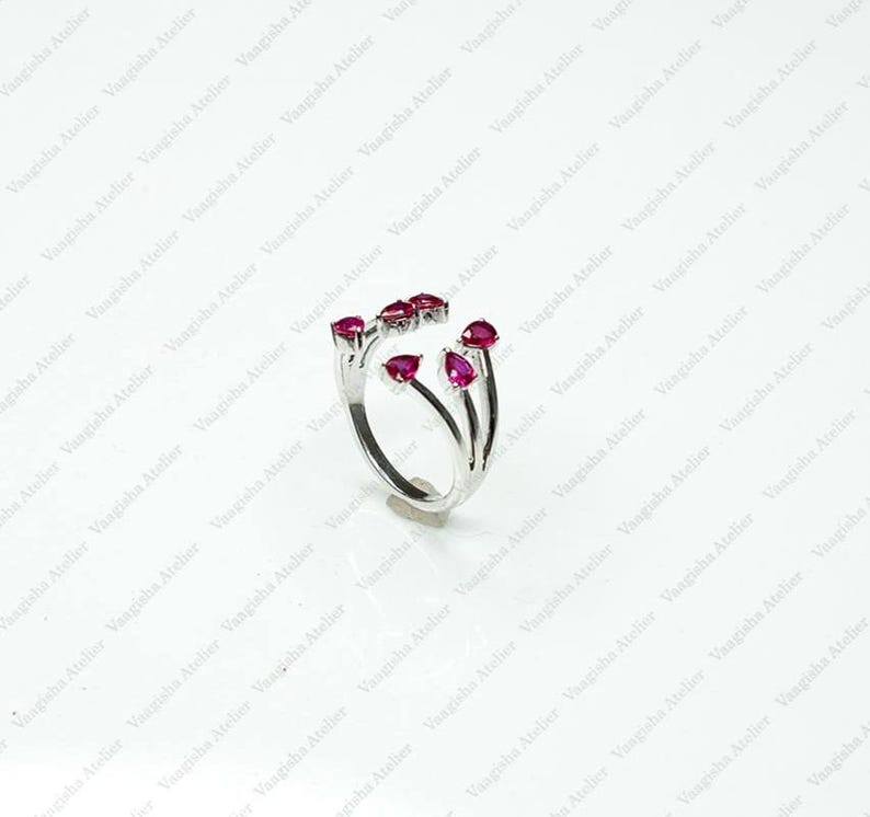 14K White Gold open bypass ring featuring six pear-cut ruby gemstones in a modern floral-inspired design, elegant handmade fine jewelry for women, July birthstone luxury gift.
