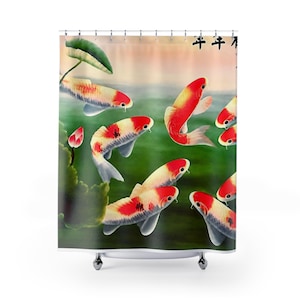 May include: A shower curtain featuring a printed scene of multiple koi fish with red, white, and black markings swimming in green water. A green lily pad and a pink lotus bud are visible on the left side, with black Chinese calligraphy at the top.