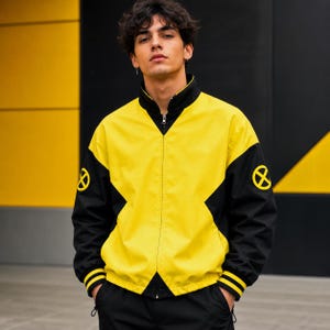 May include: A yellow and black zip-up jacket featuring a high collar, long sleeves with black cuffs, and a circular yellow X-Men logo emblem on each shoulder. The jacket has a color-blocked design with a central yellow panel and black sleeves.