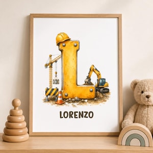 May include: A framed wall art print featuring a large yellow letter L designed with construction elements, including a yellow hard hat, a tall crane, and an excavator. The name LORENZO is printed in brown capital letters below the letter L.