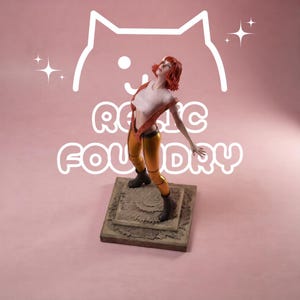May include: A figurine of a person with short red hair wearing a white crop top, an open orange vest, and yellow leggings with dark boots. The figure stands on a square textured base. Behind the figure is a white cat outline and the text RELIC FOUNDRY.