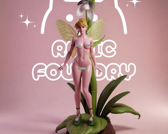 May include: A pink-skinned fairy figurine with translucent wings, blonde hair, and green lace-up shoes, standing on a large green leaf next to a tall white flower. The background features a white cat outline and the text "ROXIC FOUNDRY".