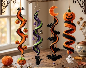 May include: A set of four crocheted Halloween spiral ornaments hanging from a branch. The spirals feature orange, black, purple, and green yarn, decorated with crocheted pumpkins, a crescent moon, bats, a cat, and a ghost. A sign reads The Happy Stitchery - Set of 4 Artisan Halloween Spirals.