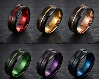 May include: Six tungsten carbide rings with a brushed black exterior and a polished inner band. The inner colors include red, gold, rose gold, green, purple, and blue. Each ring features a thin, matching colored groove around the center.