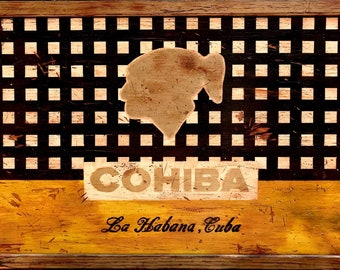 Può includere: Una scatola di legno con un motivo a scacchi bianco e nero e una silhouette marrone di una testa umana. La scatola ha un'etichetta che dice "COHIBA La Habana, Cuba".