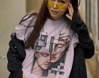 May include: A light purple t-shirt featuring a graphic print of two stylized faces integrated with geometric block shapes in shades of gray and green. The shirt is worn with a black long-sleeved jacket and blue denim jeans, paired with yellow-tinted sunglasses.