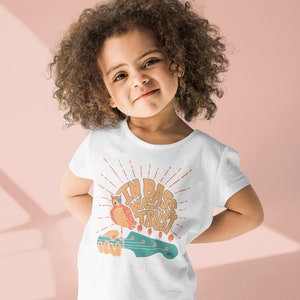 In Bass We Trust Designed by Justin Oltesvig Youth t-shirt perfect for beginner bassists, musicians