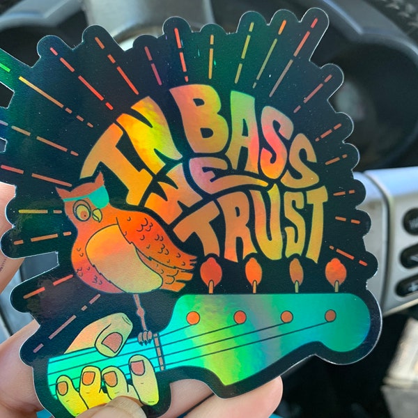 Holographic 4”x4” In bass we Trust Slap Designed by Justin Oltesvig Perfect sticker for that Bass Player in your life! Bass, musician, DJ
