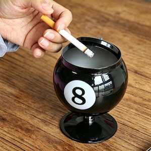 8 ball cigarette Cigarette, and cards Eight ball pool hi-res stock