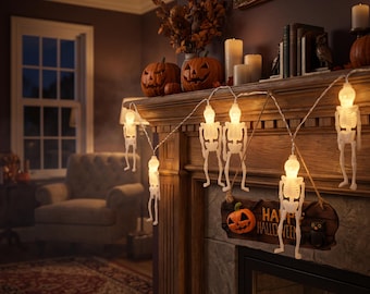 May include: A string of white skeleton-shaped LED lights featuring illuminated skulls and rib cages. The decorative light strand is draped across a wooden fireplace mantel, accompanied by a hanging sign that reads Happy Halloween.