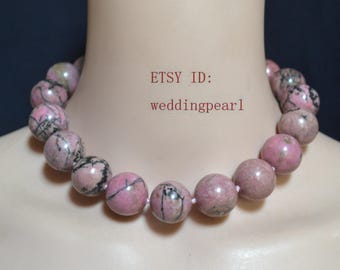 May include: A pink beaded necklace with black veining. The necklace is made of large, round beads. The text "ETSY ID: weddingpearl" is visible in the image.