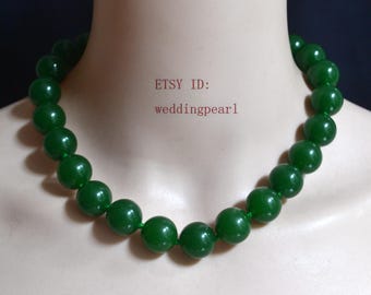 May include: A necklace featuring a single strand of large, round, dark green beads. The beads are uniform in size and strung together on a matching green cord. The text "ETSY ID: weddingpearl" is visible in the center of the image.