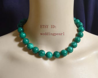 May include: A necklace of large, round, green beads. The beads are strung together to form a choker style necklace. The text "ETSY ID: weddingpearl" is visible in the image.
