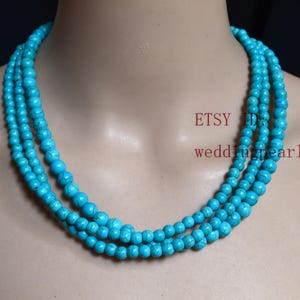 Halsband med trippelsträngat turkos, 6-8 mm syntetiskt turkospärlor