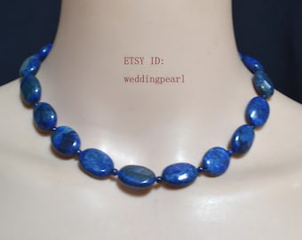 May include: A necklace composed of oval, deep blue gemstones. The stones are strung together, forming a continuous loop. The text "ETSY ID: weddingpearl" is visible.