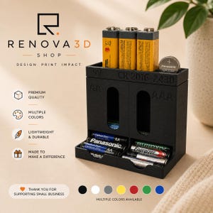 May include: A black 3D-printed battery organizer with labeled slots for 9V, AA, AAA, and CR2016-2430 batteries. The unit features vertical storage for 9V batteries and horizontal trays for AA and AAA batteries, with the text Renova 3D Shop visible.