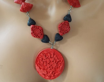 handcrafted  red and black carved cinnabar beaded necklace 21" long 2" disc fan cinnabar black heart cinnabar