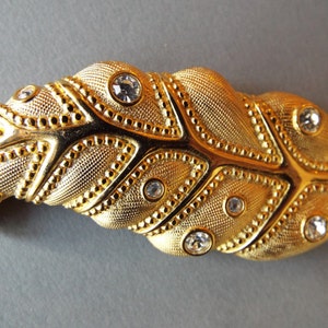 Large gold plated  leaf brooch signed Swarovski crystal jelly cabs swan logo
