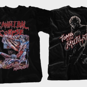 May include: A black short-sleeved t-shirt featuring a graphic print. The front displays the text "CANNIBAL CORPSE" in red with a detailed illustration of figures. The back features the text "TOMB OF THE MUTILATED" with a dark, skeletal figure.