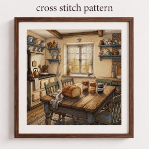 May include: A framed cross stitch pattern depicting a rustic kitchen scene with a wooden table, a loaf of bread, three jars of preserves, chairs, shelves filled with pottery, and a window with white curtains. The text cross stitch pattern is visible.