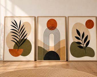May include: A set of three framed wall art prints featuring abstract shapes and botanical elements in shades of olive green, terracotta, and beige. The designs include black line art of palm leaves, a central archway, and a circular sun motif.