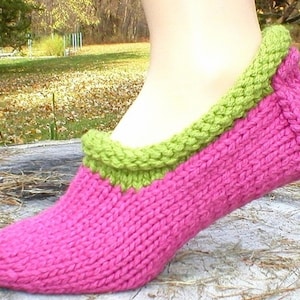 May include: Pink knitted slipper with a green knitted trim around the top.