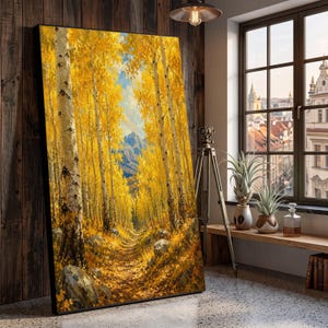 Könnte beinhalten: Ein großes, rechteckiges Wandbild mit Rahmen, das einen Waldweg zeigt, der von hohen Birken mit leuchtend gelben Herbstblättern gesäumt ist. Das Gemälde zeigt einen schmalen Feldweg, der auf ferne blaue Berge unter einem hellen Himmel zuführt.