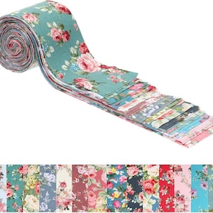 May include: A collection of fabric strips rolled into a bundle and laid out flat, featuring a variety of floral patterns in shades of teal, pink, red, blue, and cream. The strips display diverse rose motifs and botanical designs on cotton fabric.