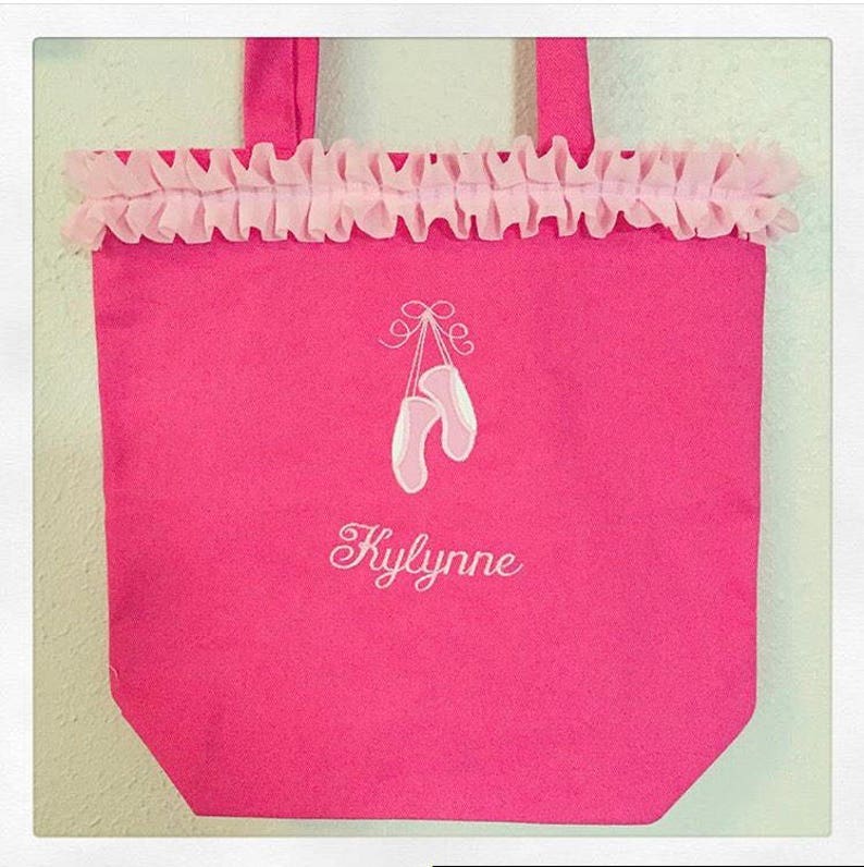 Pink ballet bag with embroidered applique of ballet slippers and name embroidered below slippers