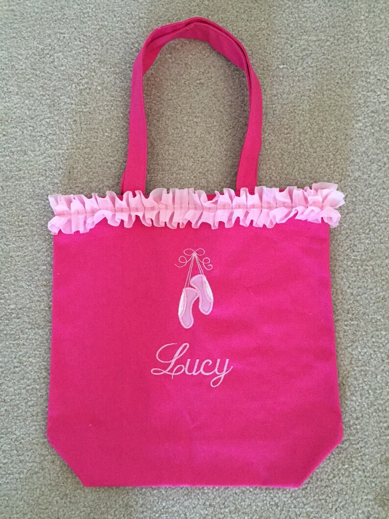 Pink ballet bag with embroidered applique of ballet slippers and name embroidered below slippers