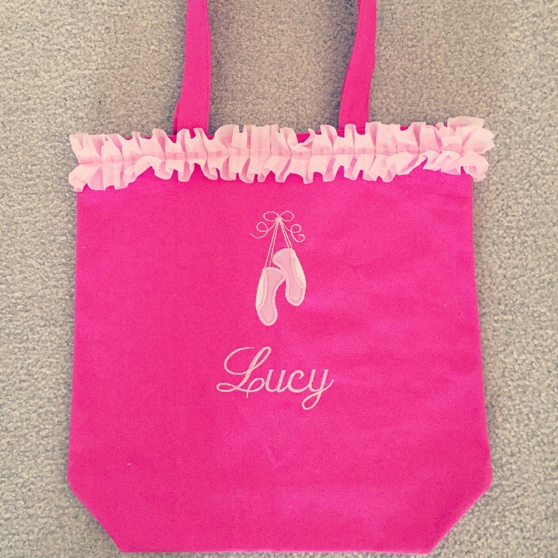 Pink ballet bag with embroidered applique of ballet slippers and name embroidered below slippers