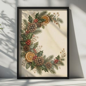 May include: A framed wall art print featuring a crescent-shaped arrangement of holiday greenery, including pine needles, holly leaves, brown pinecones, bright red berries, and dried orange slices, set against a light cream-colored background.
