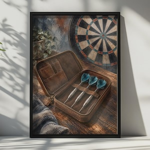 May include: A brown leather zipped case containing three metal darts with blue flights. The case is open, revealing internal slots and a dedicated holder for the darts. A dartboard is visible in the background, along with a potted plant.