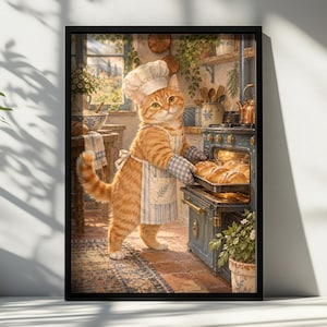 May include: A framed wall art print depicting an orange tabby cat wearing a white chef hat, a blue and white striped apron, and matching oven mitts. The cat is placing a metal tray of baked bread rolls into a vintage blue kitchen oven.