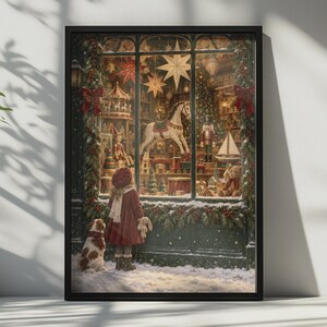 May include: A framed wall art print depicting a child in a red coat and a dog looking into a toy store window decorated for Christmas. The window display features a rocking horse, a nutcracker, a carousel, and hanging star ornaments.