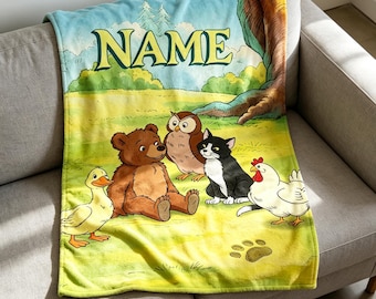 May include: A soft fleece blanket featuring a colorful illustration of a duck, a brown bear, an owl, a black and white cat, and a chicken in a grassy field. The word NAME is printed in large yellow letters at the top under a blue sky.