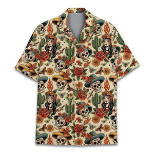 May include: A short-sleeve button-down shirt in a light beige color featuring an all-over print of skulls wearing cowboy hats, women with dark hair and floral crowns, red roses, green cacti, orange flames, butterflies, and bees.