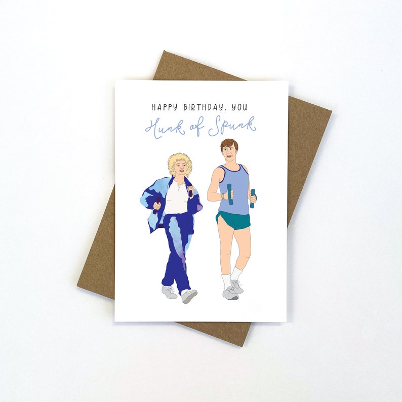May include: A greeting card with a cartoon illustration of two people exercising. The card reads "Happy Birthday. You hunk of spunk."