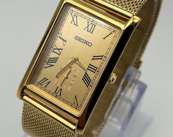 Seltene Vintage Seiko Slim Gold, rechteckige Vintage-Armbanduhr mit römischen Ziffern und Metallarmband