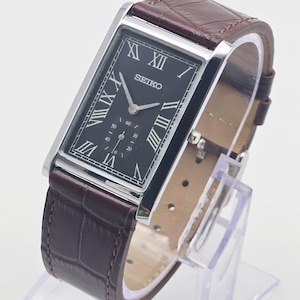 Rare Vintage Seiko Slim Black Rectangular Seiko wrist watch Brown leather strap, Roman numerals